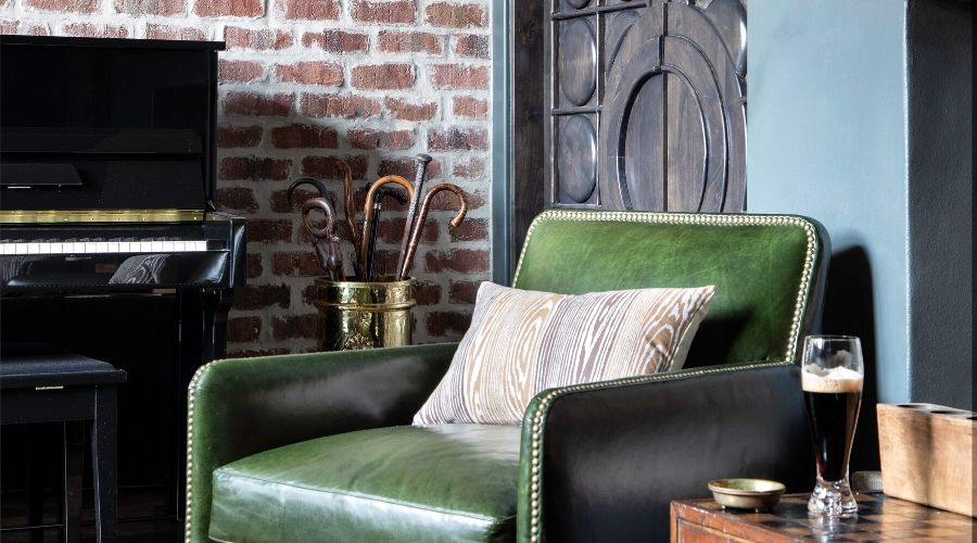An Irish green chair sits ready at this secret pub in a Houston home