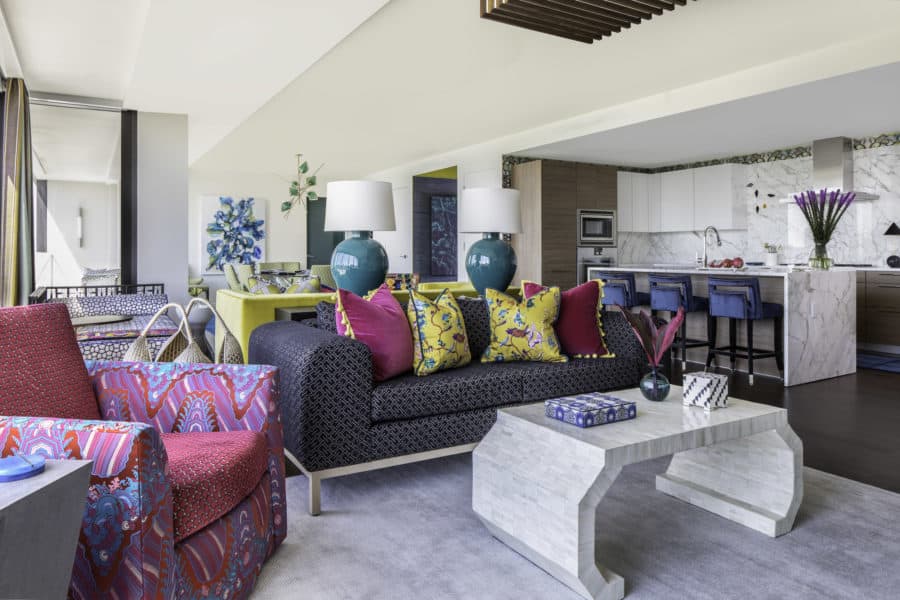 A view of the colorful living room at The River Oaks, designed by Laura U