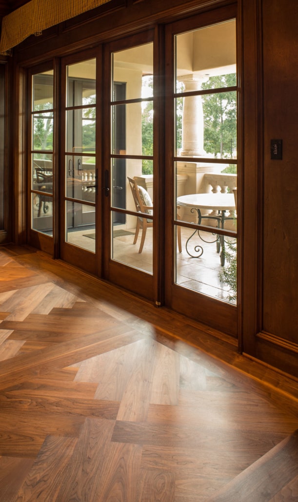 A close up of a Schenck floor with glass doors to the outside