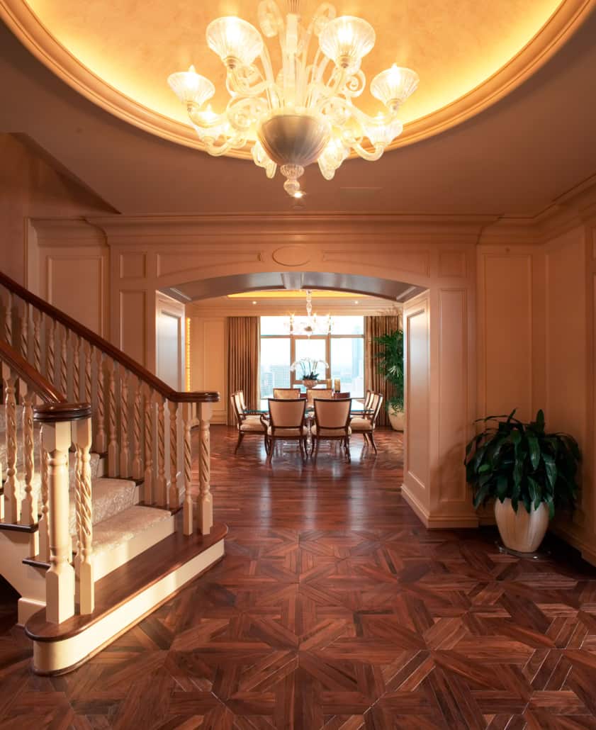 A stunning home entry with chandelier and Schenck flooring