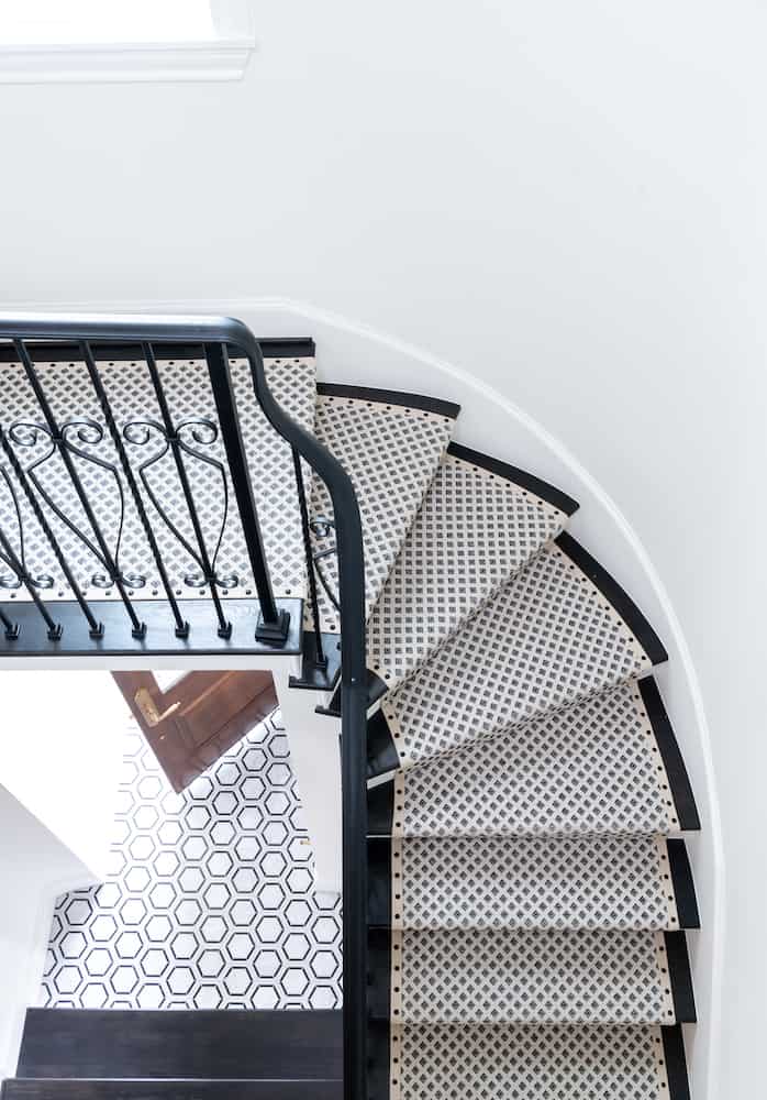 Black and white stair runner in Houston home renovation by Laura U Interior Design