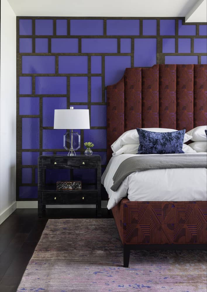 Bold master bedroom interior design by Laura U with laser cut paneling and lacquer wallpaper 