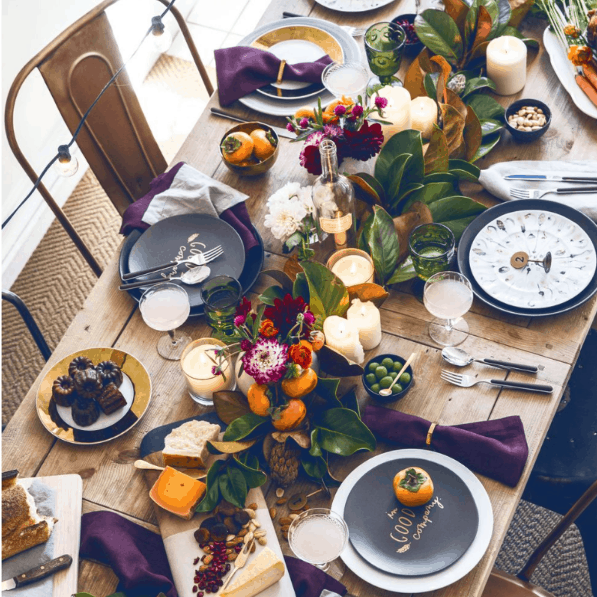 Bright and bold Thanksgiving table design idea using magnolia and citrus