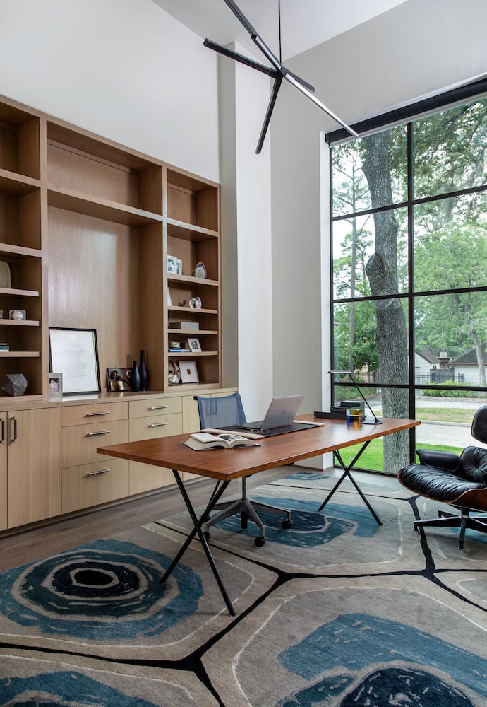 Chic office design by Laura U with Herman Miller desk and Eames lounge chair