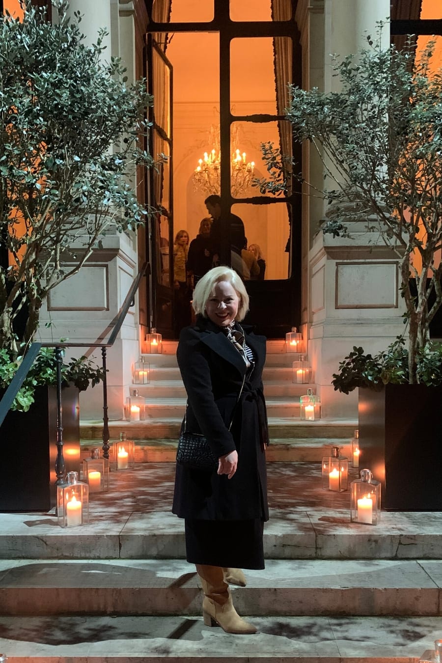 Houston interior designer, Laura Umansky, stands in front of the Ambassador