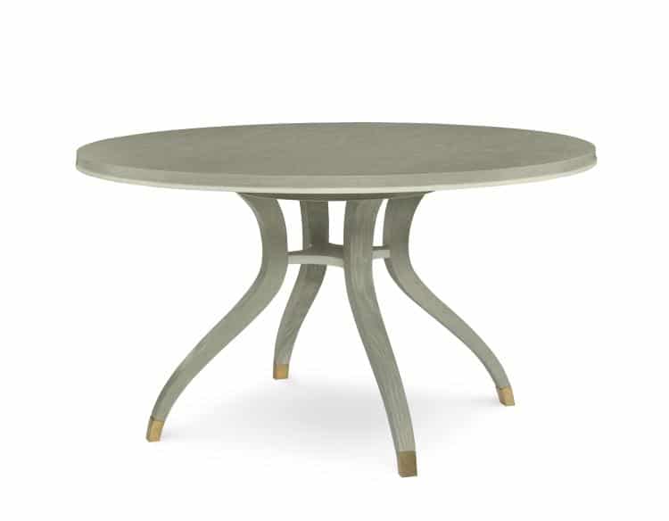 Light oak table with curved legs and brass detailing