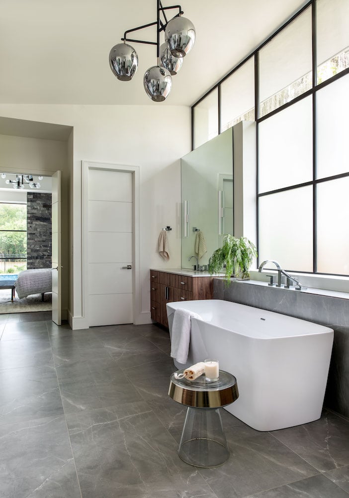 Memorial Interior Design | Modern, minimalist master bathroom with chrome accents
