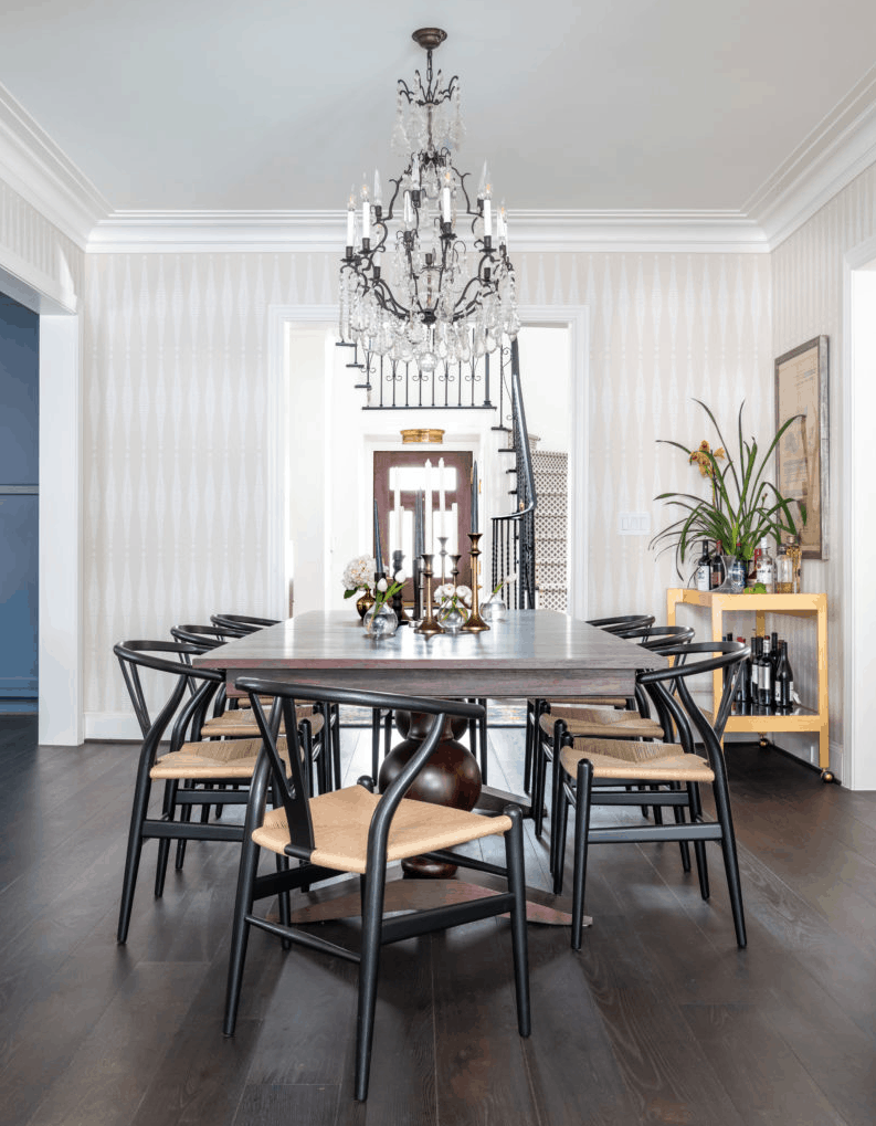 Modern dining room designed by Laura U Interior Design with black wishbone chairs