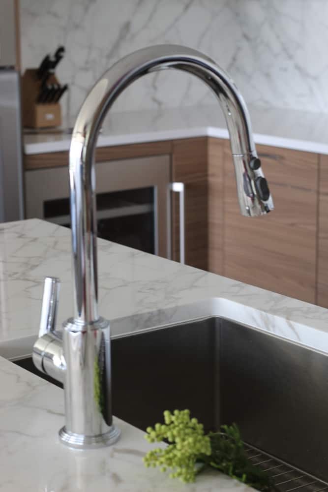 Modern kitchen faucet in luxury high rise condo kitchen 