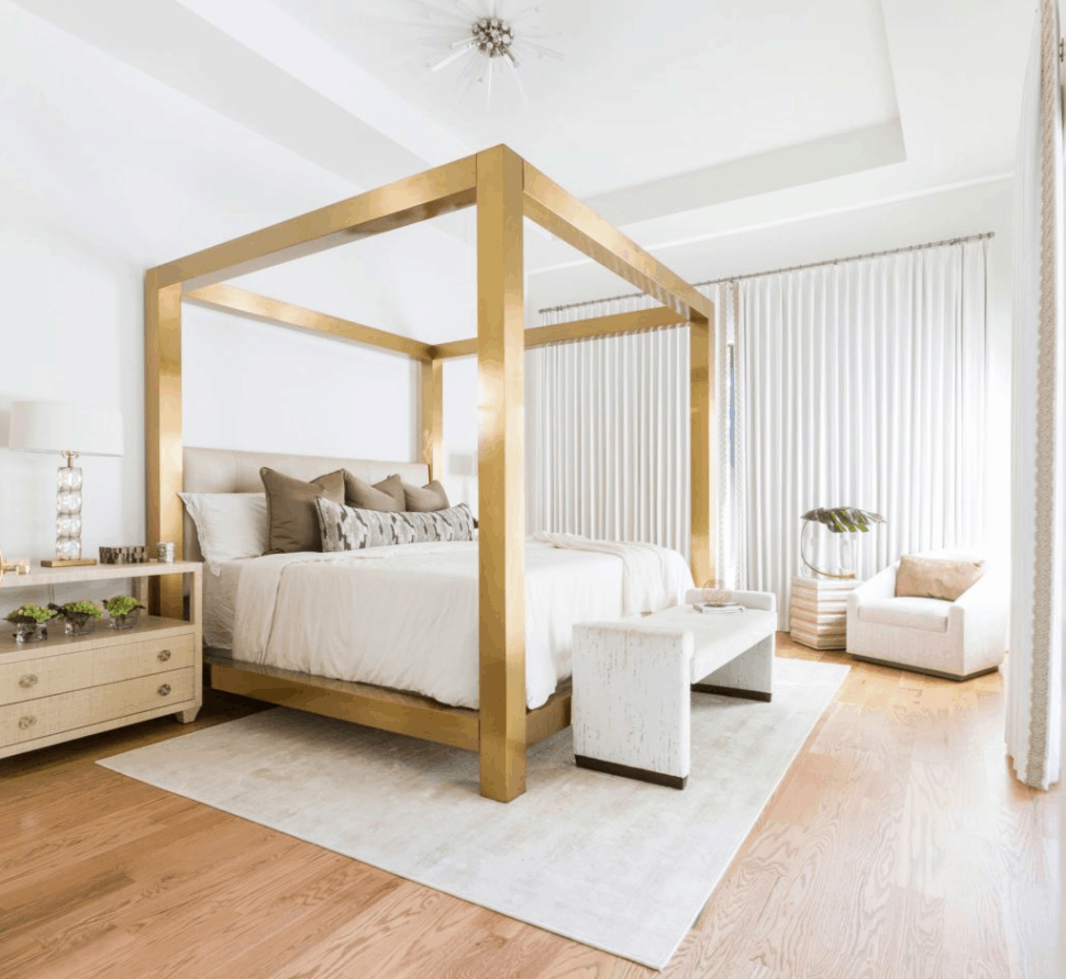 Modern master suite featuring statement bed frame and greenery, a must-have home decor item 