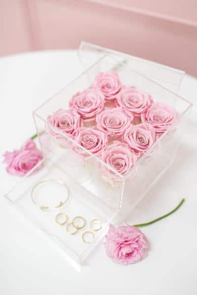 Pink everlasting rose arrangement in acrylic container from JoyBox flowers