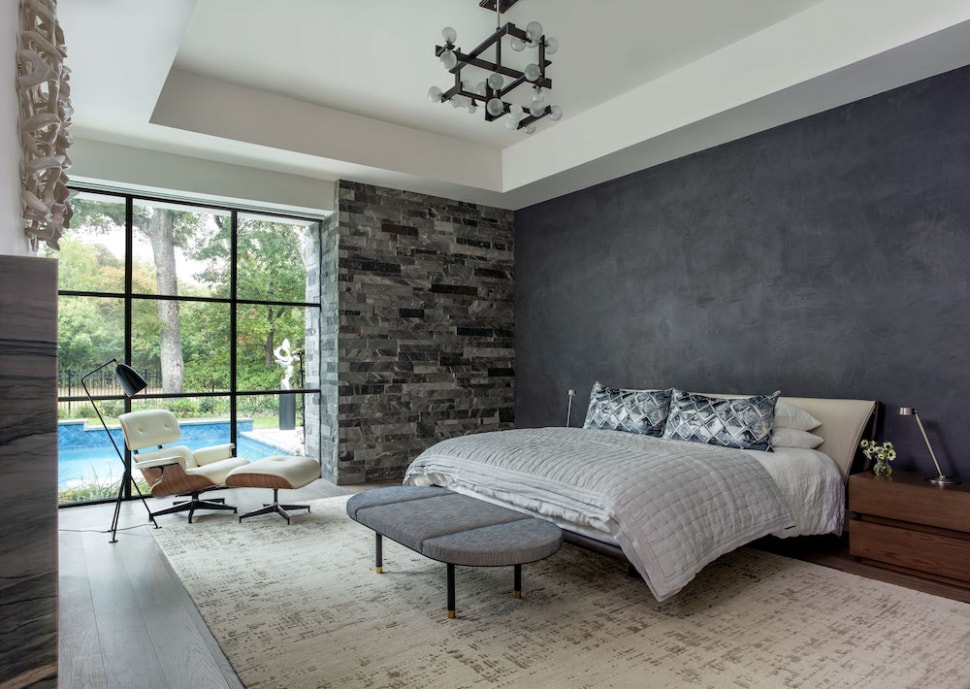 Sophistcated master bedroom with custom accent wall designed by Laura U Interior Design