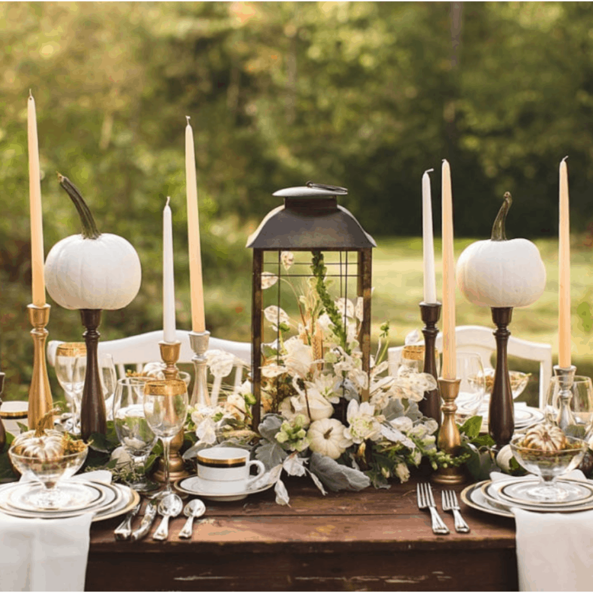 Thanksgiving table idea with green, cream and metallic candlesticks