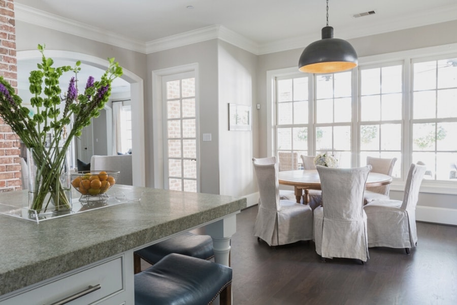 The breakfast room at Creekside after renovation with bright linen slipcovers