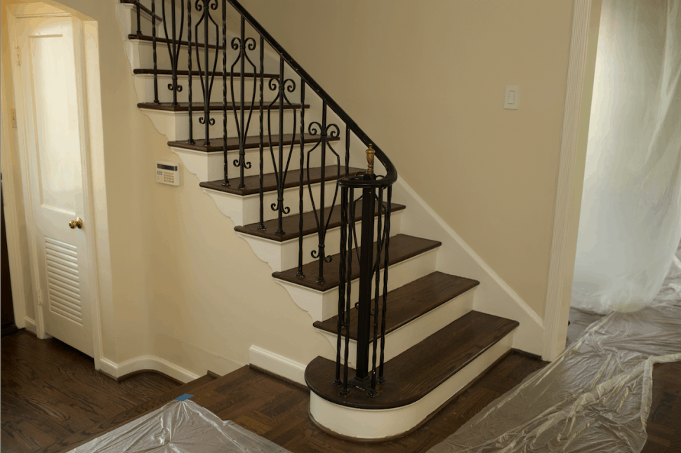 Wood staircase in Houston home before renovation was completed