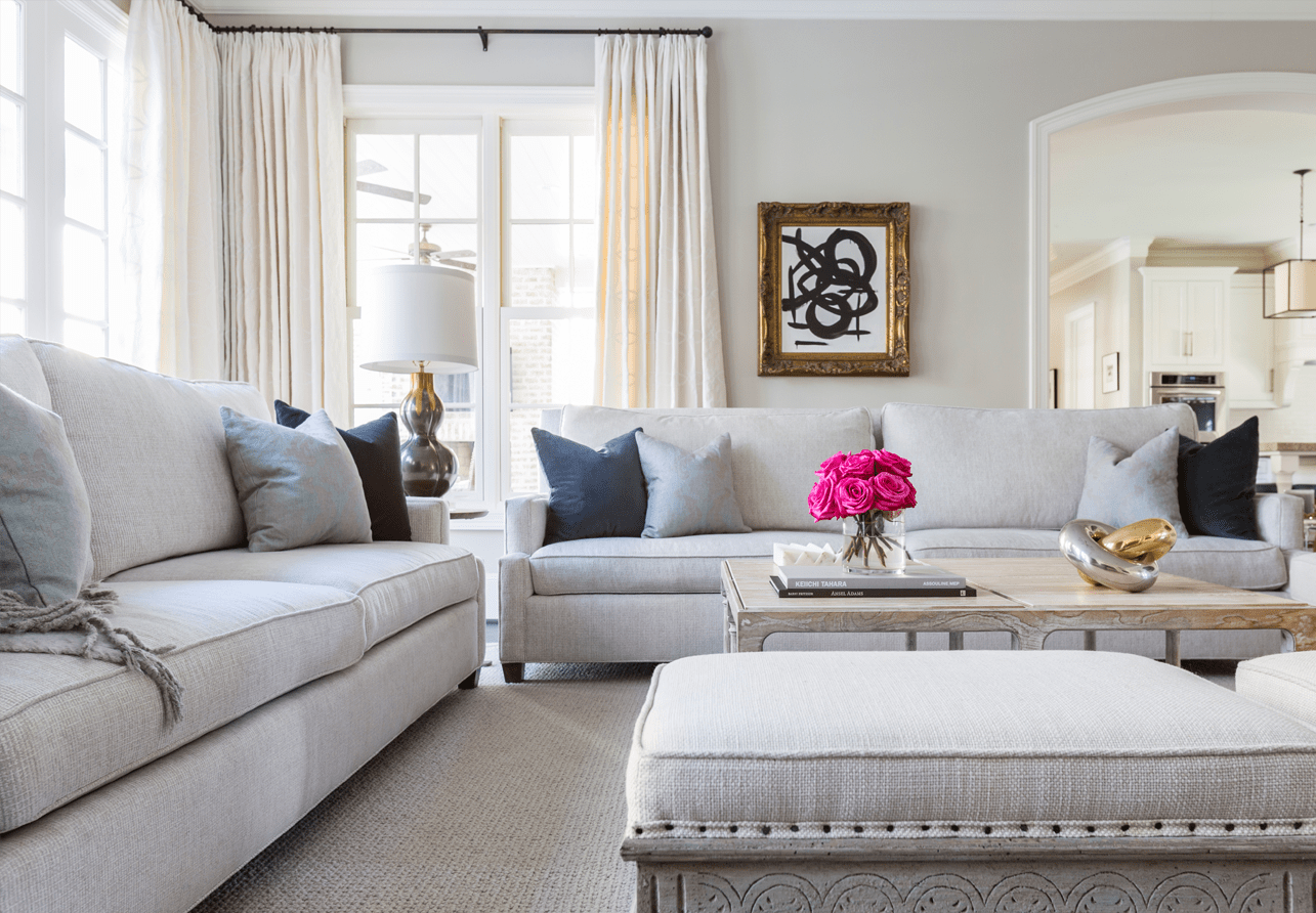 Elegant mix of soft grays create a sense of comfort in the Creekside Residence living room.