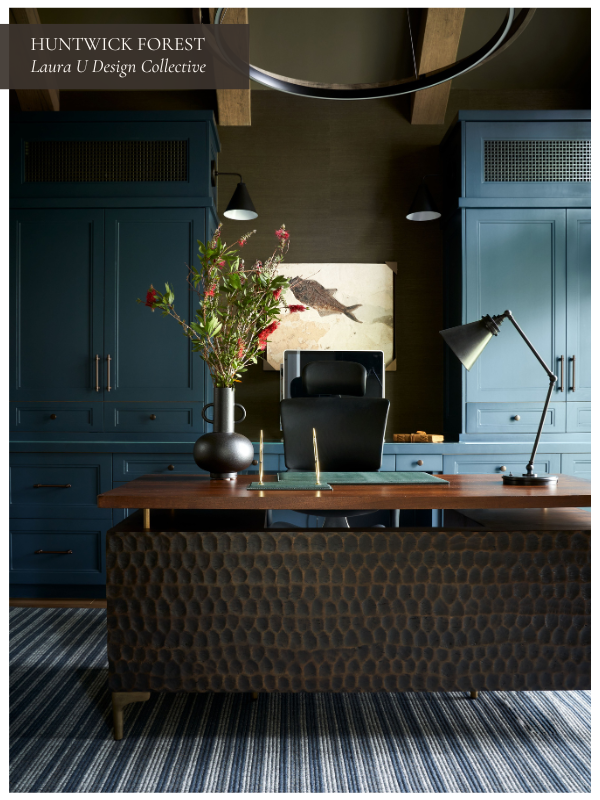 Moody home office featuring dark teal built-ins, a hammered metal desk, and rich textures.