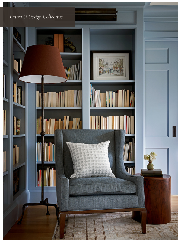 Reading nook in a dedicated room with built-in bookcases, a stylish accent chair, and soft lighting.