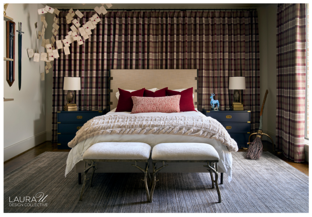 Harry Potter guest bedroom with floor-to-ceiling plaid drapery, burgundy pillows, navy nightstands, floating acceptance letters, wall-mounted wands, and a broom.