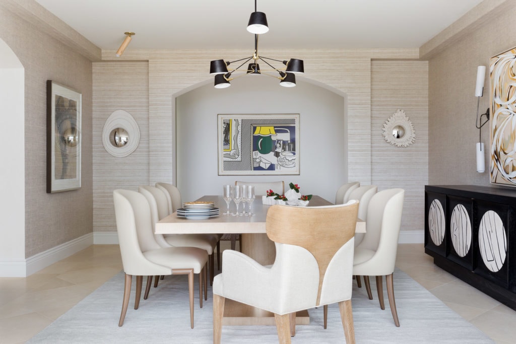 A modern dining room in tonal shades, Theodore Alexander chairs, and a Roy Lichtenstein