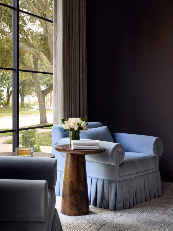 Two custom chairs in front of a large picture window