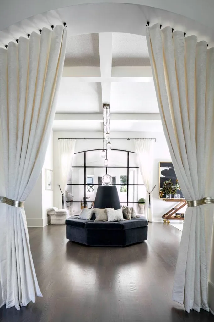 An entry way with custom roundalette and drapery