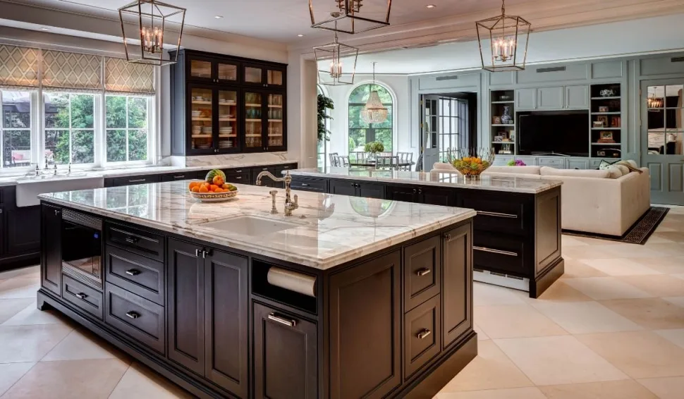 An open concept living space that incorporates two islands, separating prep from eating.