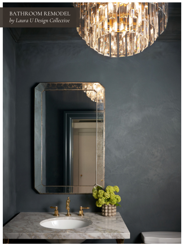 Glamorous powder room design with a crystal chandelier, dark walls, and marble vanity top. A high-end bathroom remodeling project that uses custom designs and lighting fixtures, showcasing how project complexity and finishing touches can impact the final cost per square foot.
