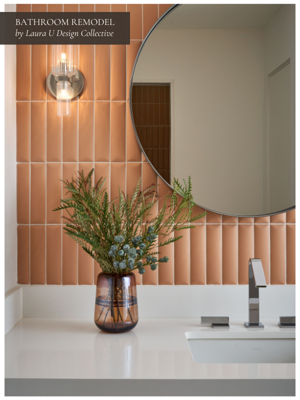 Warm-toned bathroom remodel featuring terracotta-like tile backsplash, a round mirror, and simple modern faucet.