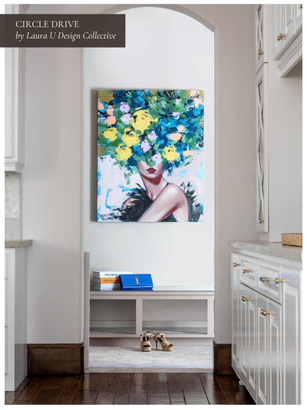 Arched nook with bold portrait artwork, a simple bench, and statement blue and yellow tones