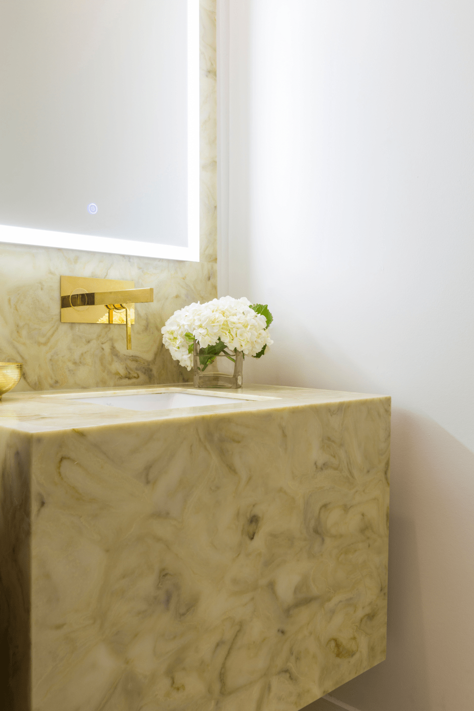 Countertop in neutral color with contrasting faucets in this beautiful powder room by LauraU