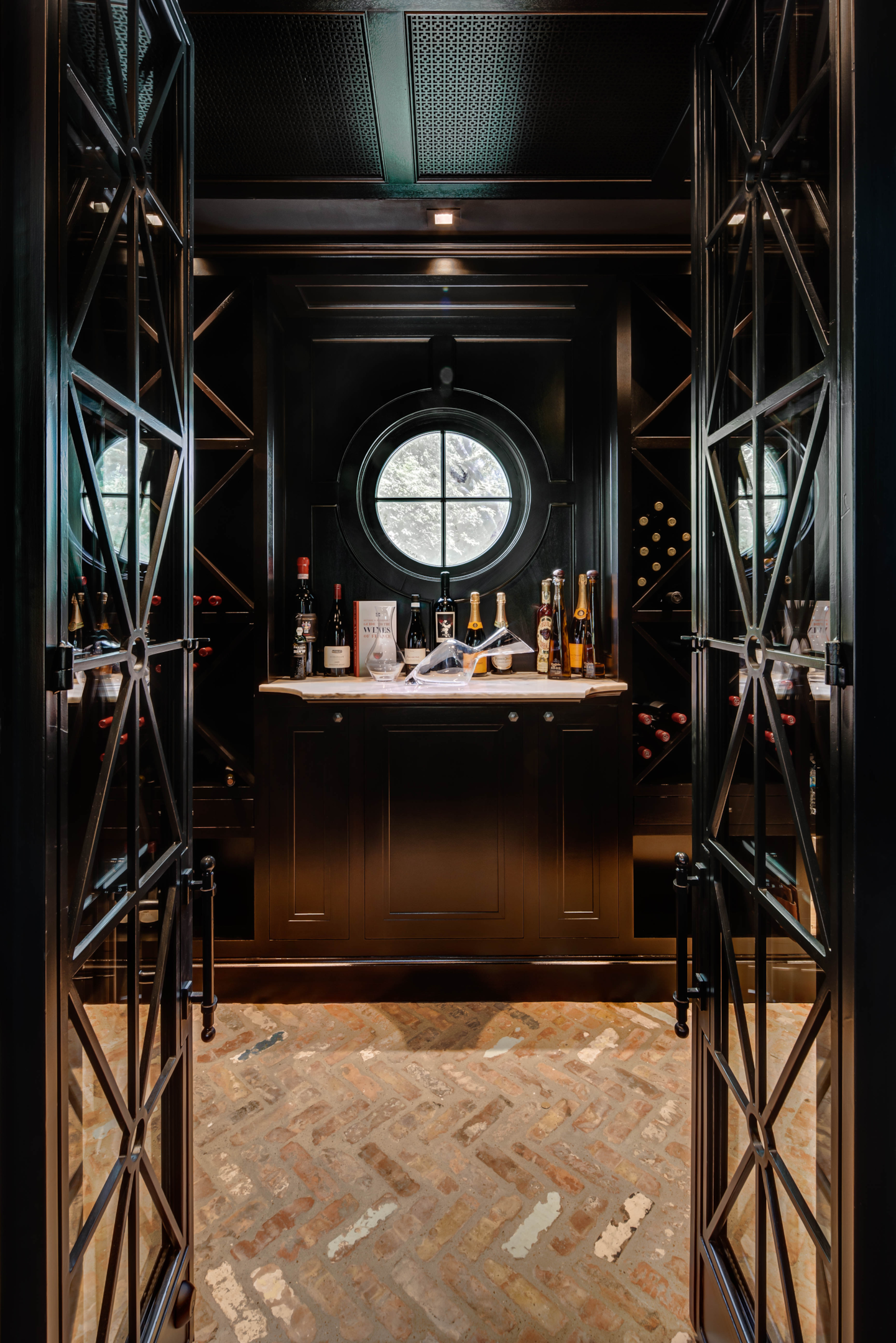 We adore this glamorous wine room from our Willowick Residence remodel.