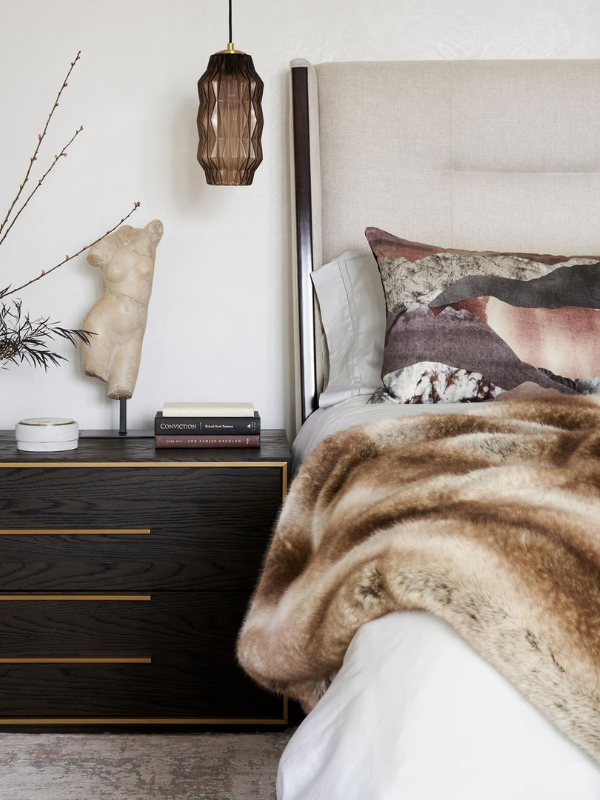 a bedroom with cozy fall textures