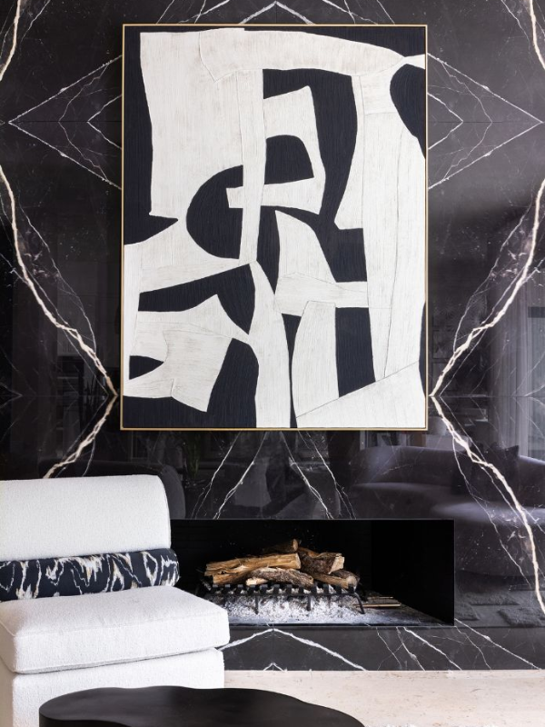 a black and white marble fireplace