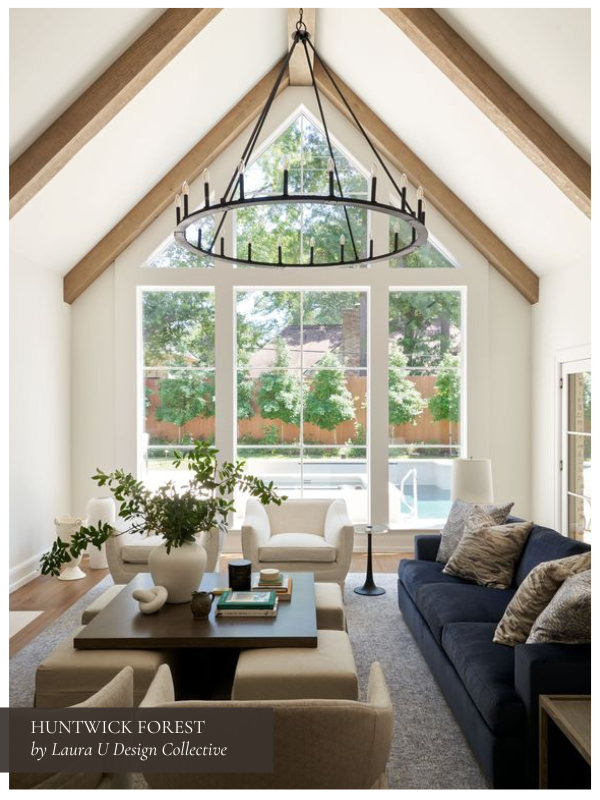 the living room in our Huntwick Forest project with transitional furniture in beiges and blues and large windows
