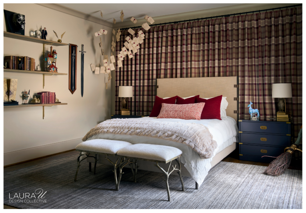 Hunter's Creek bedroom featuring floor-to-ceiling plaid curtains, a light upholstered headboard, burgundy accent pillows, navy bedside chests, whimsical floating letter decor, and upholstered benches.
