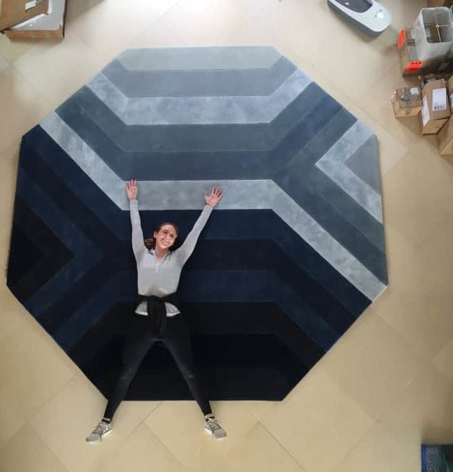 Lead designer Lexie Terry poses on a Tai Ping Rug at the Viscaino residence.