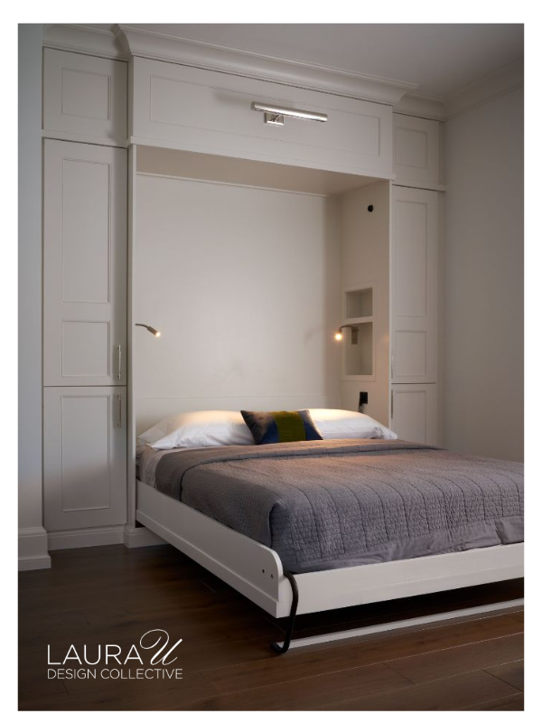 White built-in Murphy bed with gray bedding, sleeping pillows, and a small decorative accent pillow.