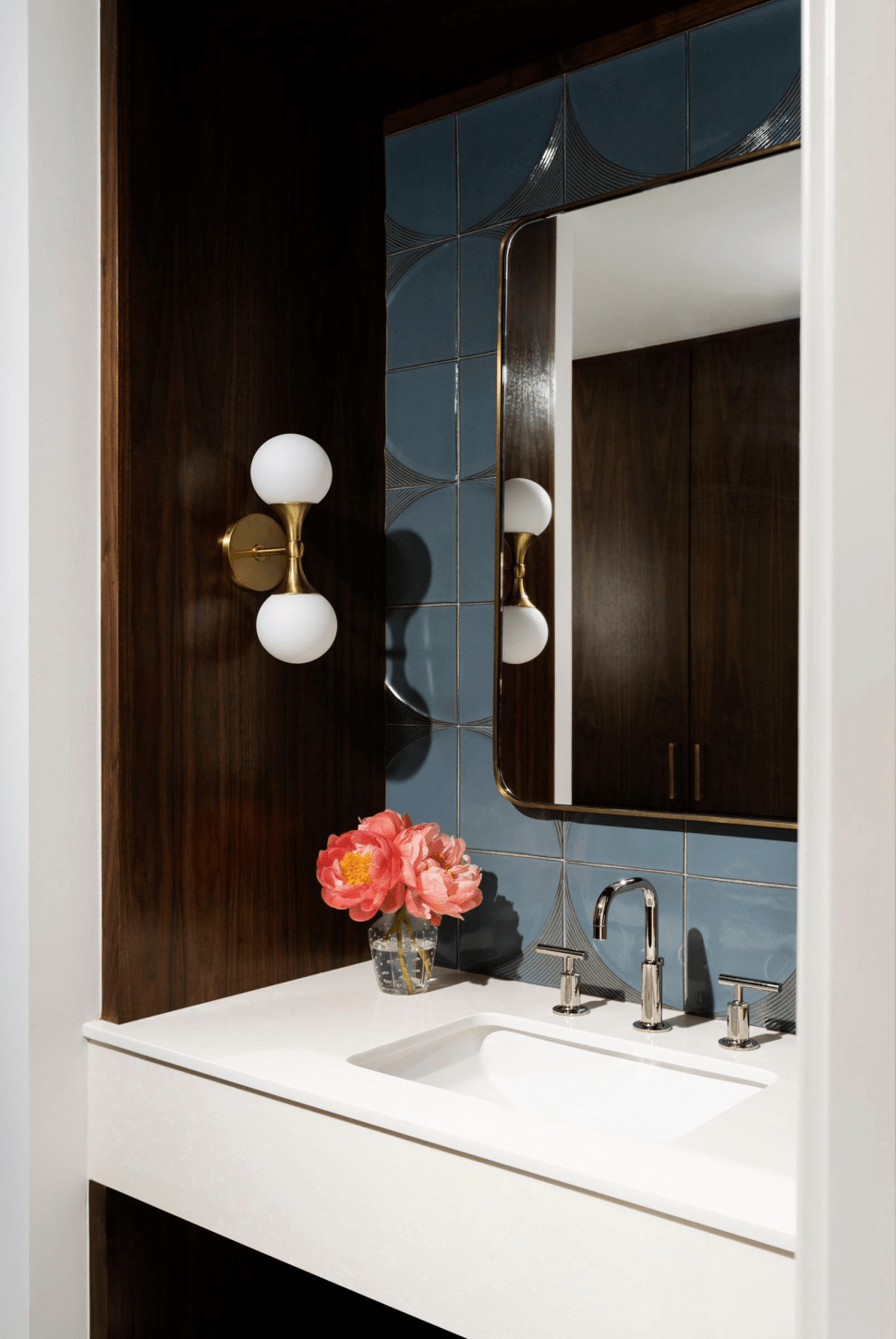 Powder room with brown cabinets, white countertop and blue tiles by LauraU, houston.