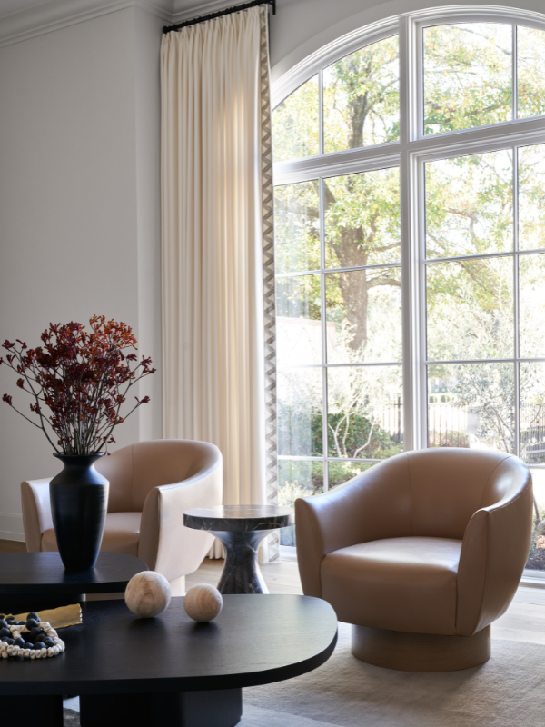 Oak Estate living room with a large arched window